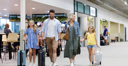 Redevelopment of Townsville Airport - Family walking through the airport